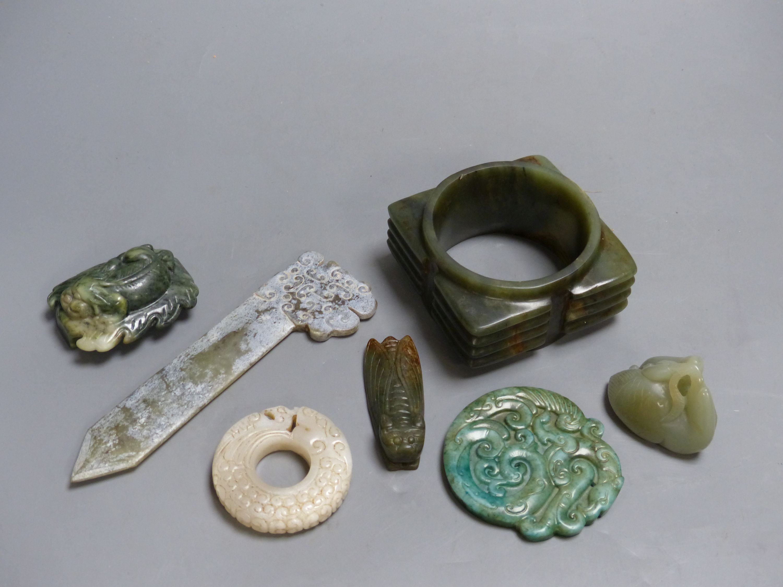 Seven Chinese jade or hardstone carvings, largest 15.5 cm